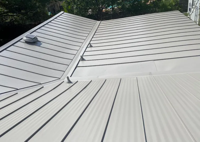 Solar attic fan installed on a metal roof for Roof Ventilation in Macclenny